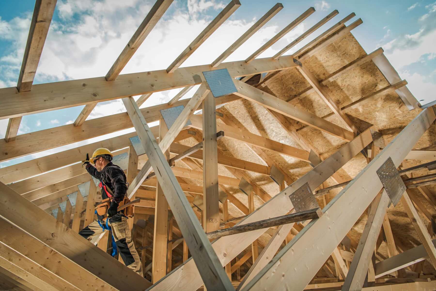 Construction worker framing a house